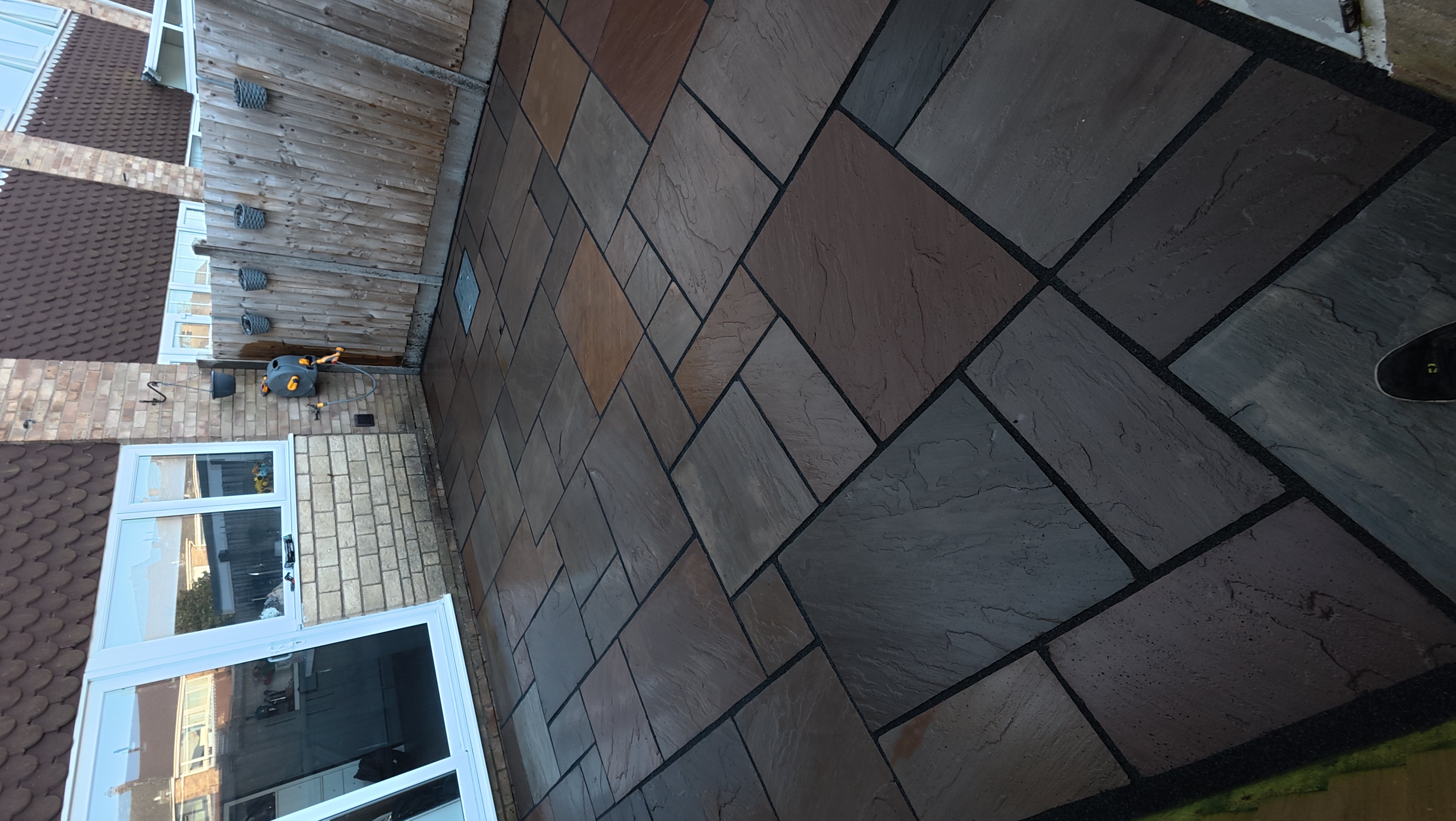 Indian sandstone patio after cleaning by ONYX